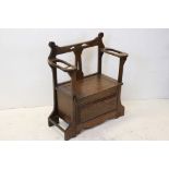 Art Nouveau Early 20th century Oak Hall Bench with hinged lid box seat and stickstands to the two