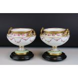 Pair of Early 20th century Cauldon Ltd Twin Handled Urns, decorated with pink roses and with gilt
