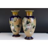 Doulton Lambeth Stoneware Vases with floral spray decoration, each approx 31cms high