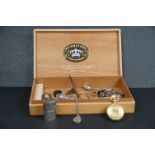 A box of mixed collectables to include watch fobs, hallmarked silver button hooks, lighter and a