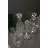 A collection of glass jugs and decanters.