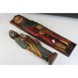 Two decorative painted carved wooden figures.