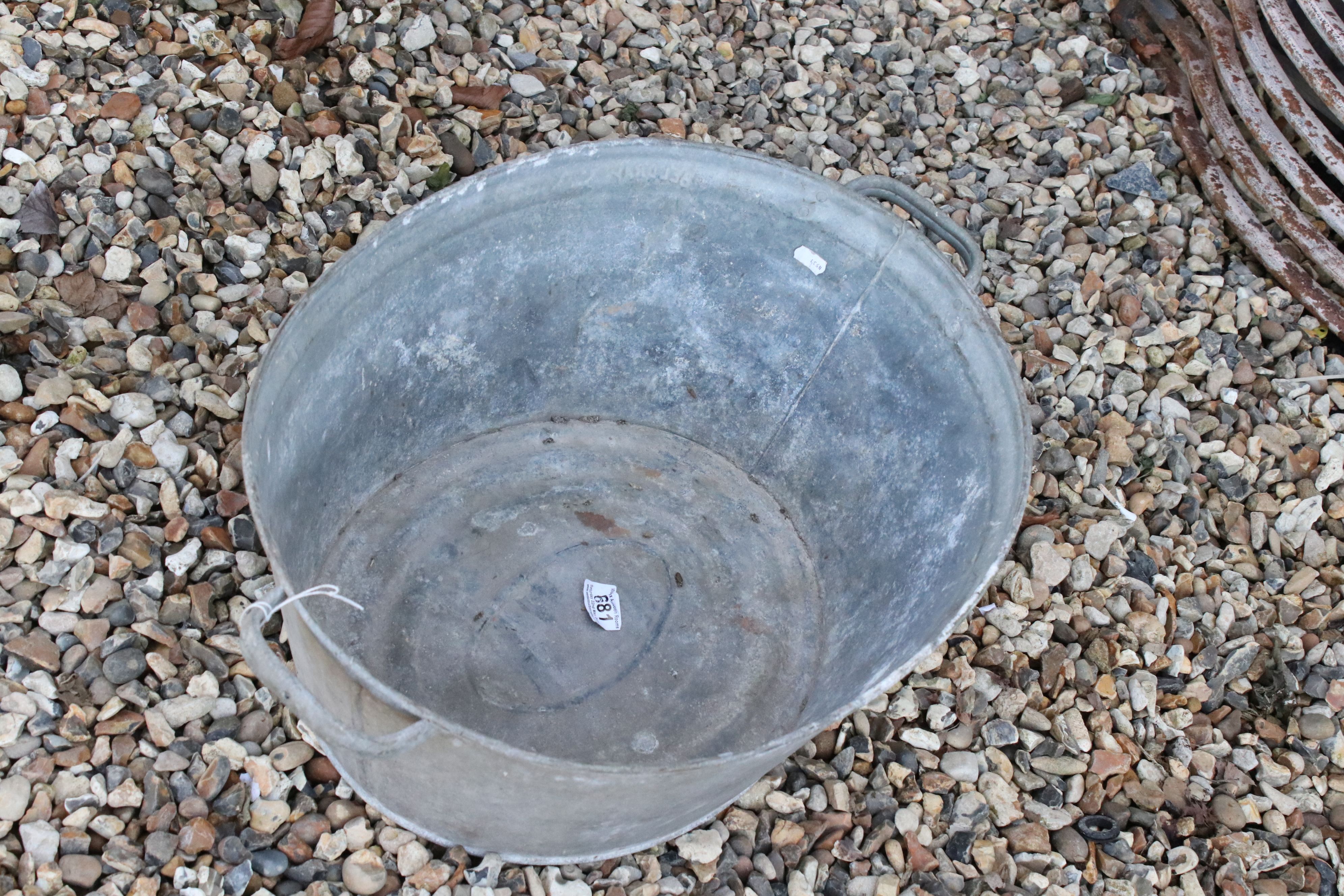 A vintage galvanised steel twin handled bucket.