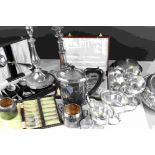 A quantity of silver plate to include candlesticks, cased knife sets, teapot, sugar bowl etc.