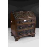 Mahogany Apprentice Piece Bureau with carved decoration to door fronts raised on bracket feet, 28cms