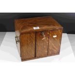 A vintage lockable desktop cabinet with two internal drawers.