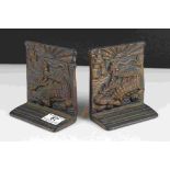 A pair of oriental style bronze bookends with dragon decoration, registration mark to reverse.