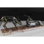 Art Deco pair of spelter Antelope mounted on a marble plinth, 55cms long