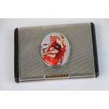 A fully hallmarked sterling silver cigarette case with decorative erotic plaque to the front,