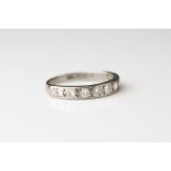 Diamond 18ct white gold half eternity ring, comprising nine round brilliant cut diamonds, flush