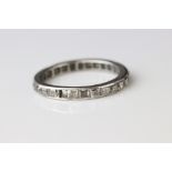 Diamond platinum eternity ring, twenty-seven square mixed cut diamonds, channel set, band width