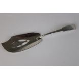 A fully hallmarked sterling silver fiddle pattern fish slice with pierced decoration forming a