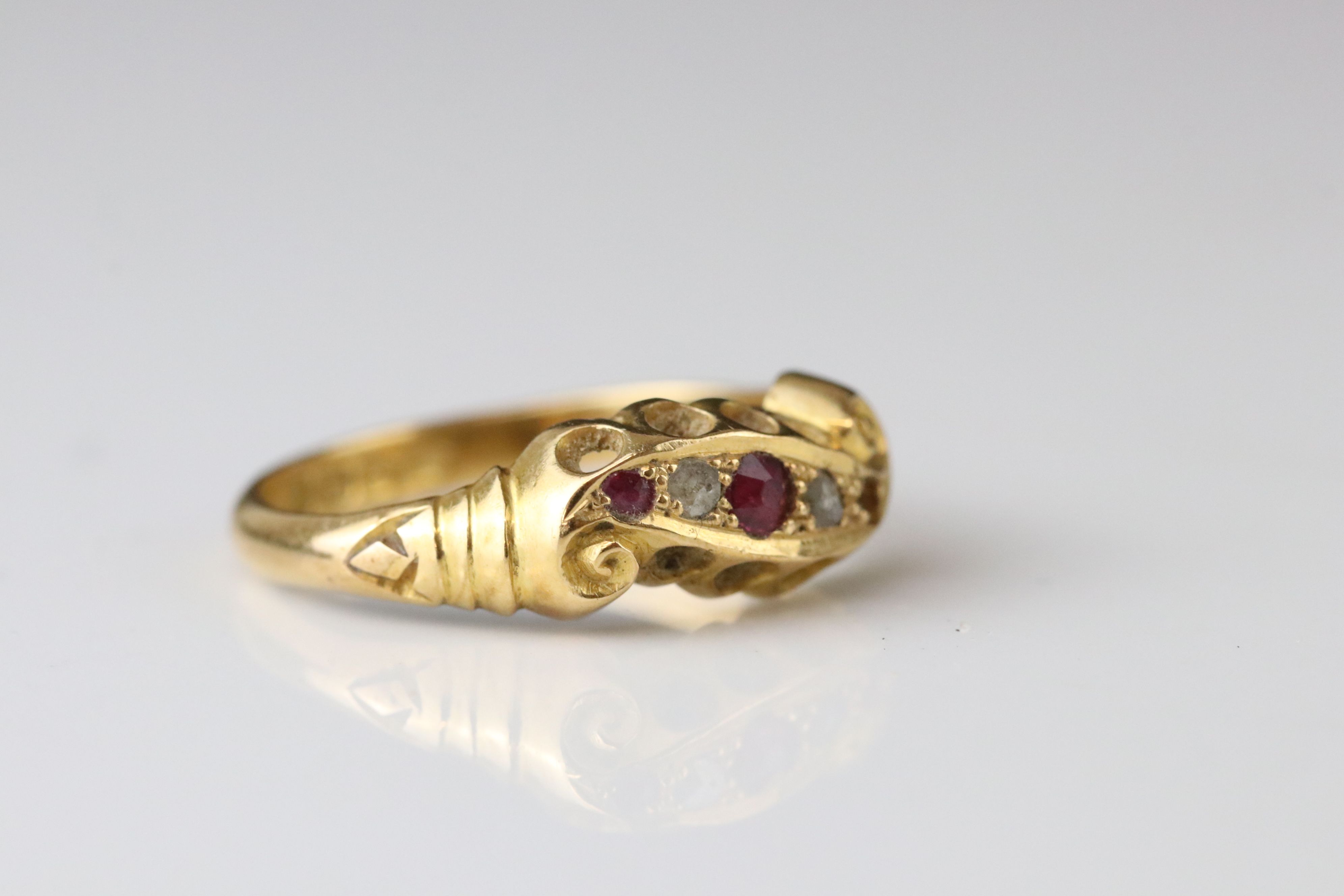 Early 20th century ruby and diamond 18ct yellow gold scroll head ring, two small round mixed cut - Image 2 of 6