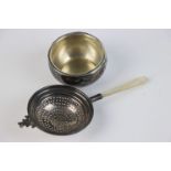 A fully hallmarked sterling silver tea strainer with mother of pearl handle, maker marked for S.