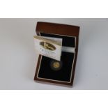 A cased London Mint office limited edition The Elizabeth & The Lion 2012 gold quarter sovereign