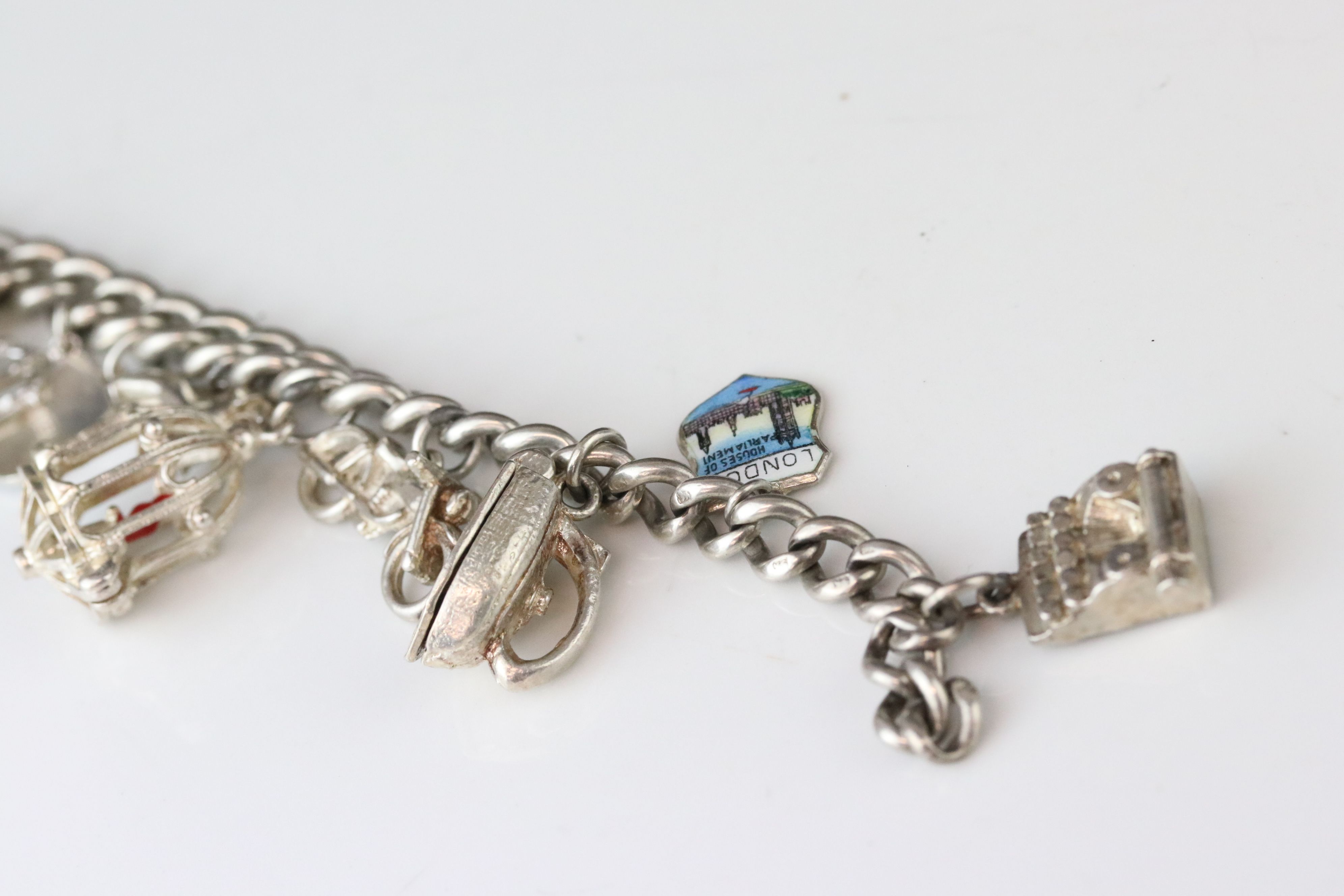 Silver curb link charm bracelet with eighteen silver and white metal charms, length approx 23cm ( - Image 2 of 15