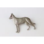 Sterling Silver Brooch in the form of a German Shepherd Dog with cabouchon ruby eye, 4cms long,