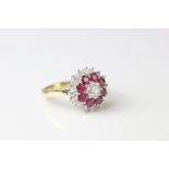Diamond and ruby three tier 18ct yellow gold and white gold set cluster ring, the principle