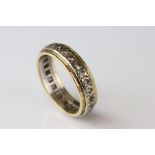White sapphire yellow metal eternity ring, ring size P½
