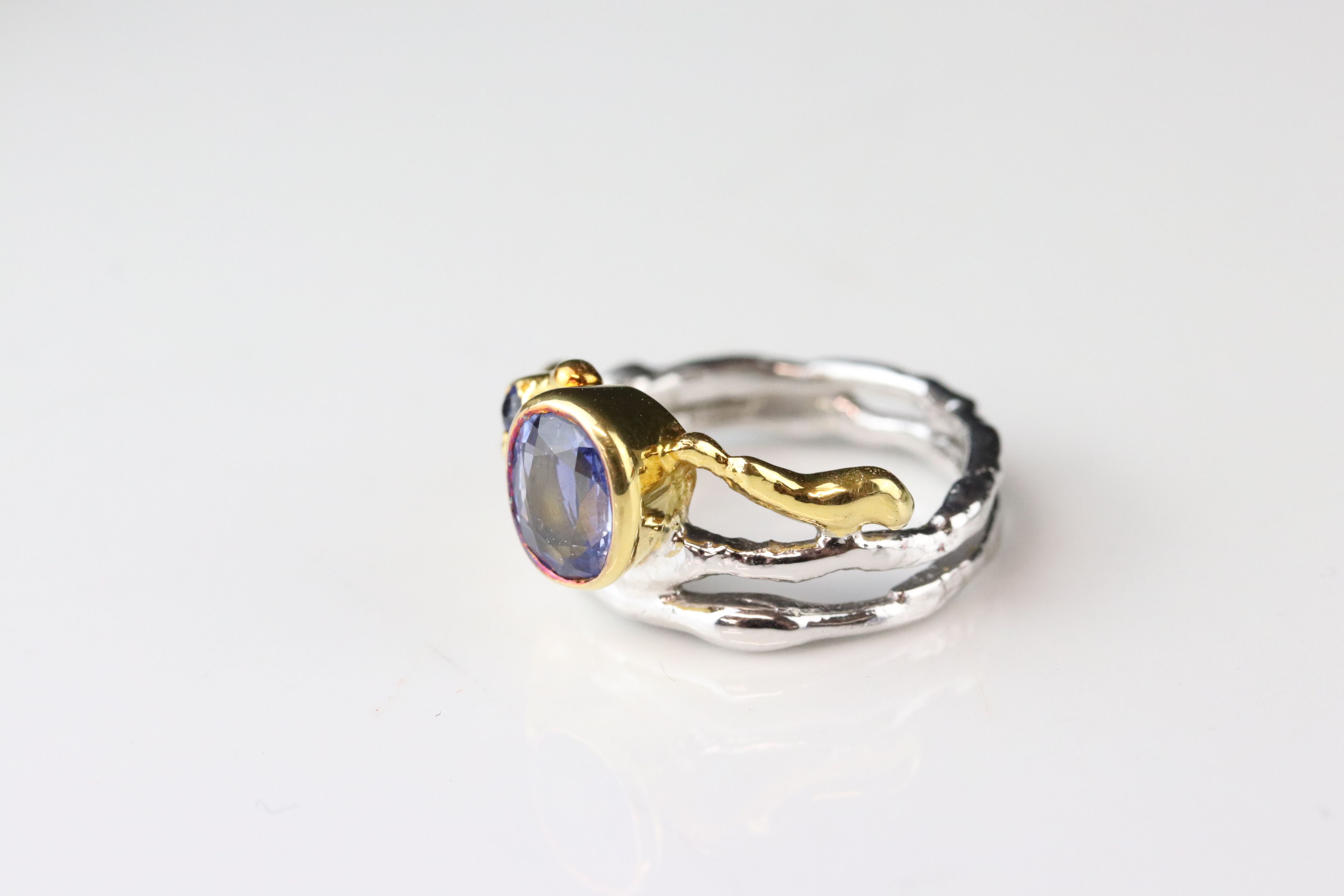 Sapphire 18ct yellow and white gold ring, the principle oval mixed cut blue sapphire measuring - Image 4 of 7