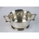 A fully hallmarked Britannia silver double handled christening cup with decorative ivory handles,