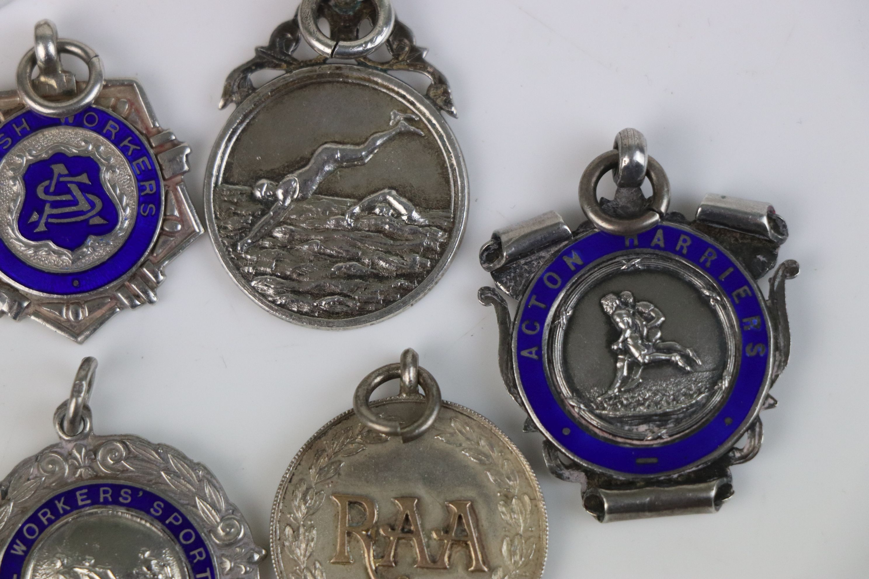 A collection of Twelve fully hallmarked sterling silver sports related watch fob medallions. - Image 6 of 9