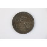 A King George III LIX 1819 silver Crown coin.