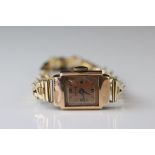 Accurist ladies 9ct rose gold cased wristwatch, coppered dial, black Roman numerals and baton