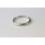 Platinum wedding band, worn foliate design, width approx 2.5mm, ring size M