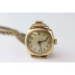 9ct gold cased wristwatch, champagne dial, black Arabic numerals and hands, crack to glass, 9ct gold