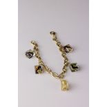 14ct yellow gold charm bracelet with five Murano style glass charms, lobster clasp, length approx