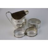 A fully hallmarked sterling silver cream jug together with three fully hallmarked sterling silver