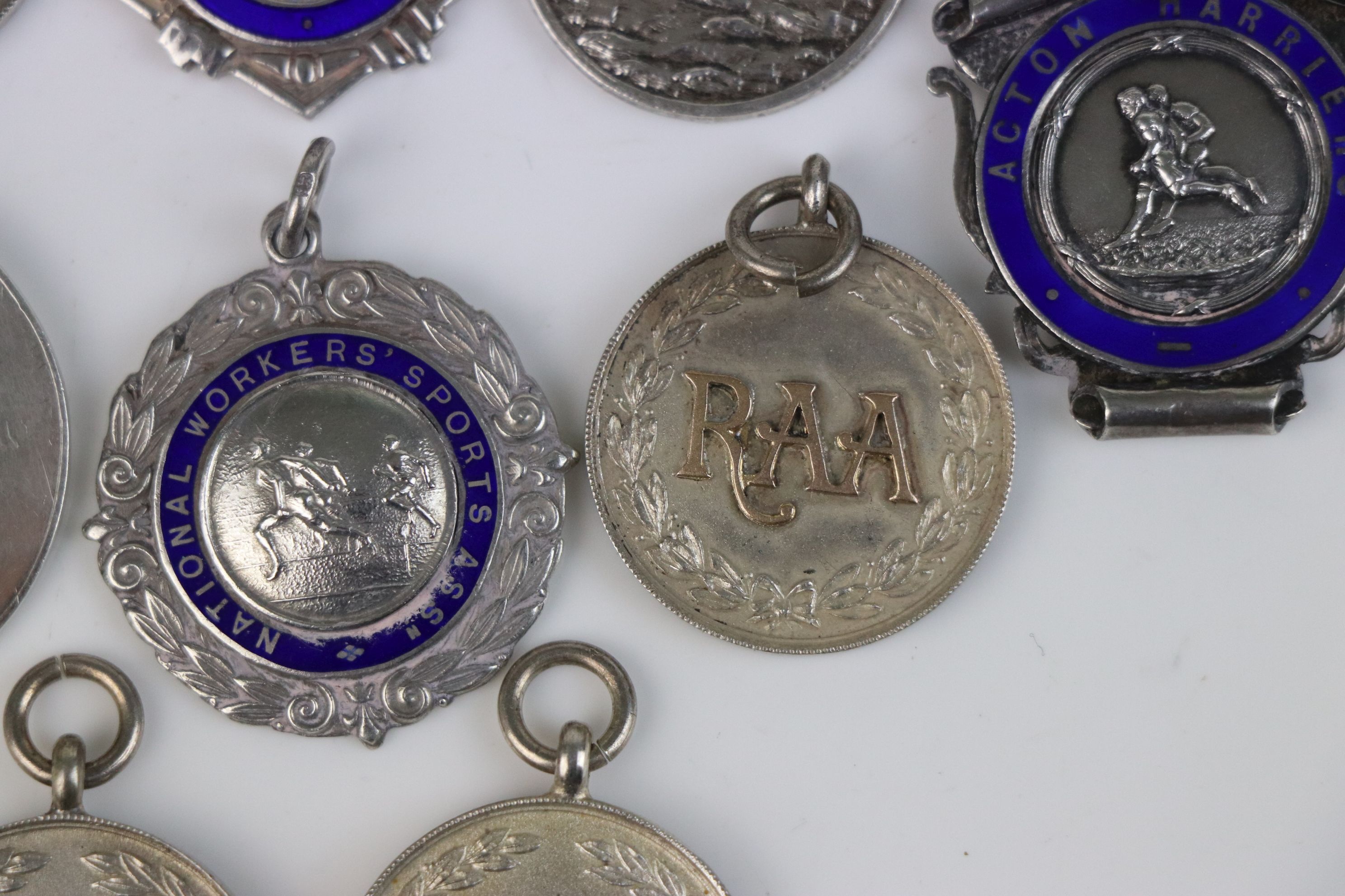 A collection of Twelve fully hallmarked sterling silver sports related watch fob medallions. - Image 9 of 9