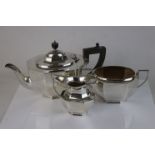 A fully hallmarked sterling silver three piece tea service, comprising tea pot, twin handled sugar