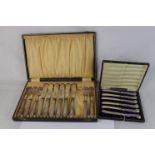 Cased set of six silver handled butter knifes, pistol and scroll pattern; together with a part-