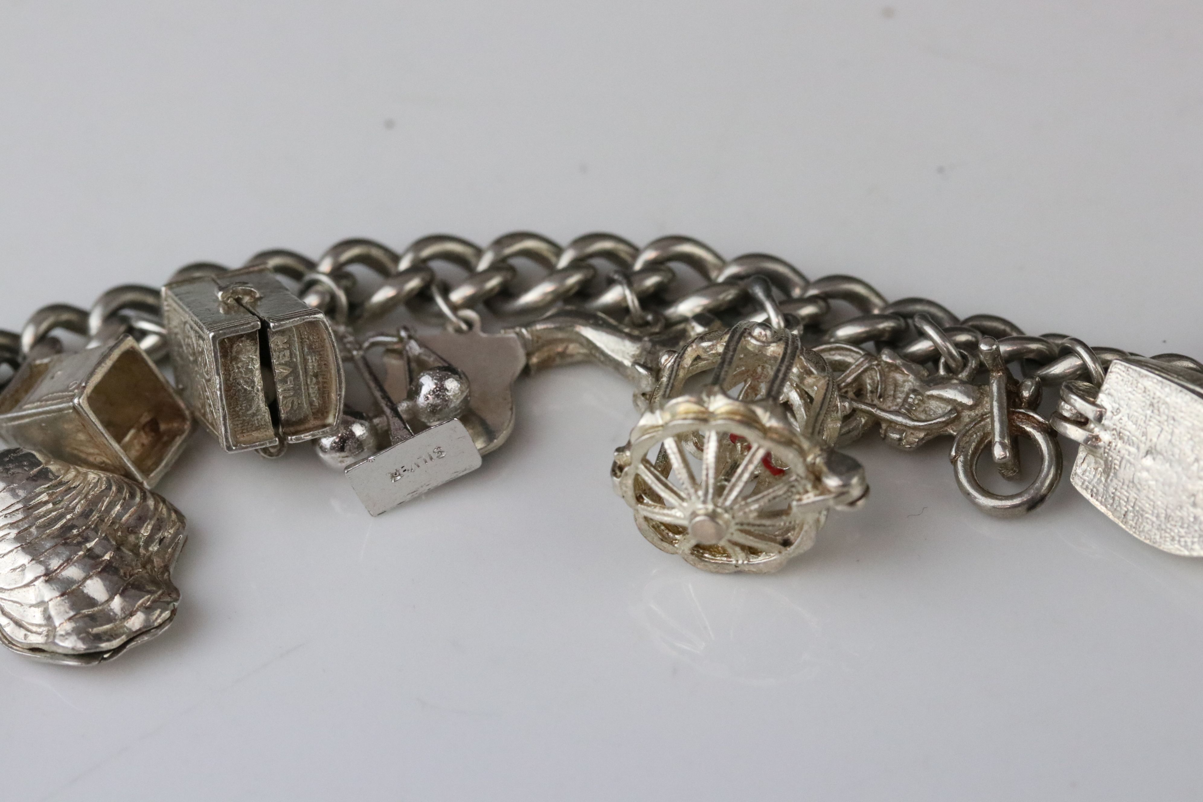 Silver curb link charm bracelet with eighteen silver and white metal charms, length approx 23cm ( - Image 6 of 15