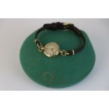 A ladies Omega 9ct gold cased wristwatch in original green scalloped presentation box.