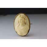 Victorian ivory cameo unmarked yellow gold oval brooch, the ivory cameo depicting female bust with