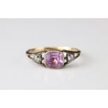 19th century diamond and lilac stone yellow metal ring, the central cushion cut lilac stone possibly