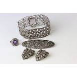 Marcasite silver jewellery to include a panel bracelet, pierced form, tongue and box clasp with