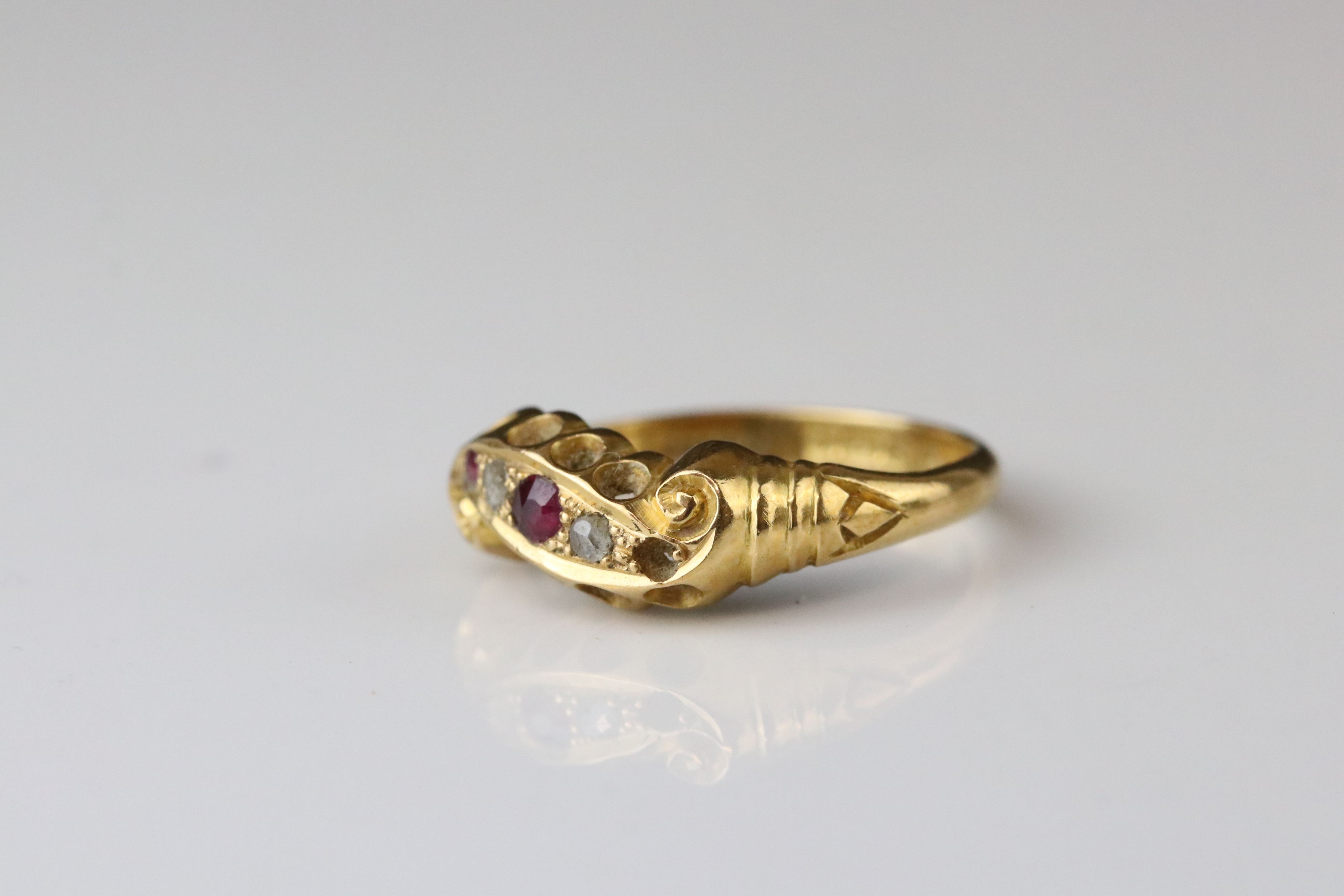 Early 20th century ruby and diamond 18ct yellow gold scroll head ring, two small round mixed cut - Image 4 of 6