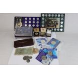 A collection of mixed British & World coins to include silver examples and banknotes together with a