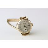 9ct gold cased ladies wristwatch, champagne dial, gold Arabic numerals, black pencil hands, 9ct gold