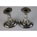 A pair of fully hallmarked sterling silver candlesticks, maker marked for Harrison Brothers, assayed