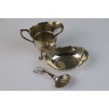 A small collection of fully hallmarked sterling silver items to include a pin dish, cream jug and