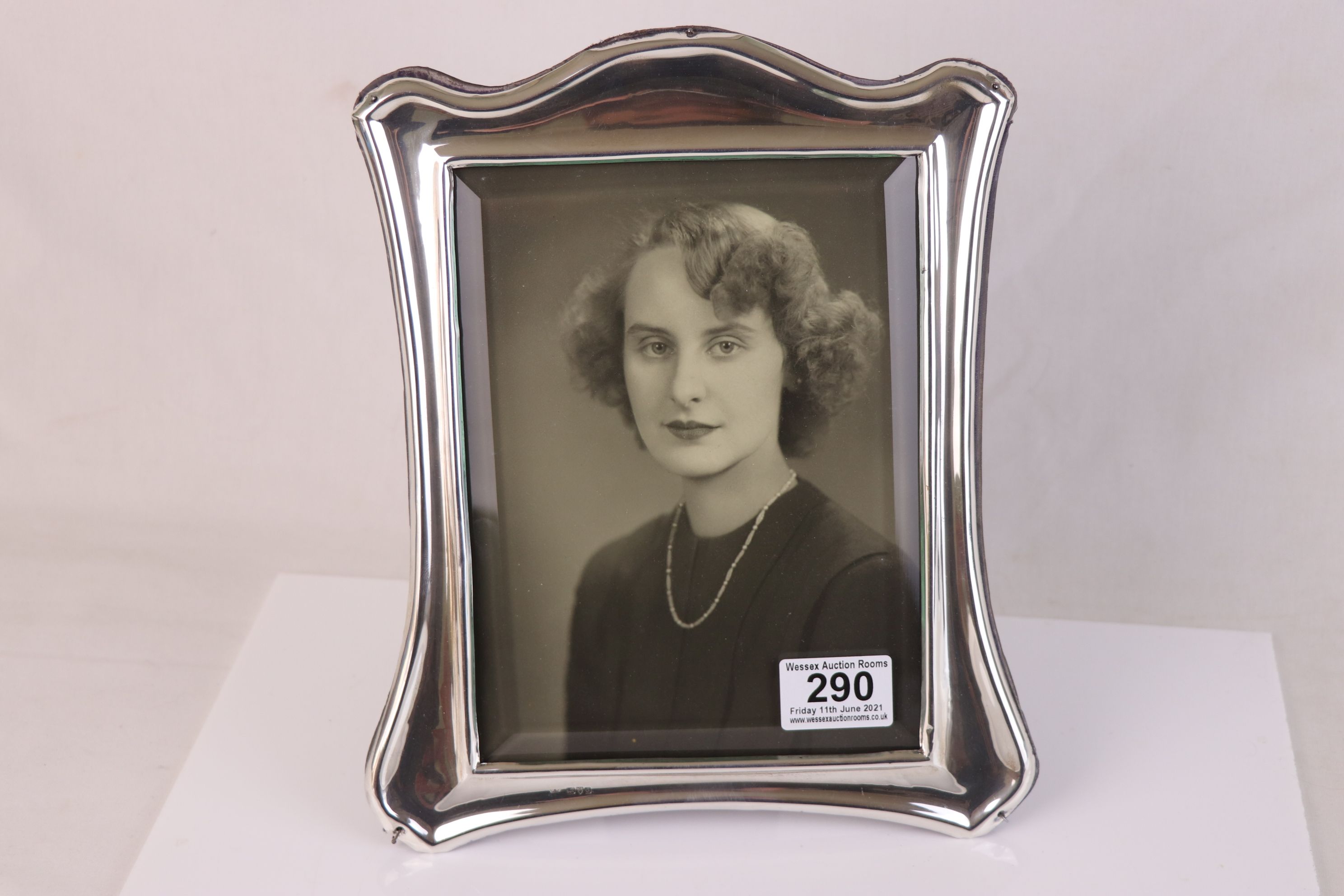 A fully hallmarked sterling silver photograph frame with bevelled glass, measures approx 10.5" x