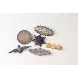 Collection of Victorian brooches to include yellow metal brooch, silver oval brooch with floral