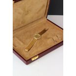 A cased Omega gift set comprising of gents 18ct gold cased watch with 18ct gold strap and clasp