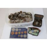 A collection of British pre-decimal and world coins to include silver examples.