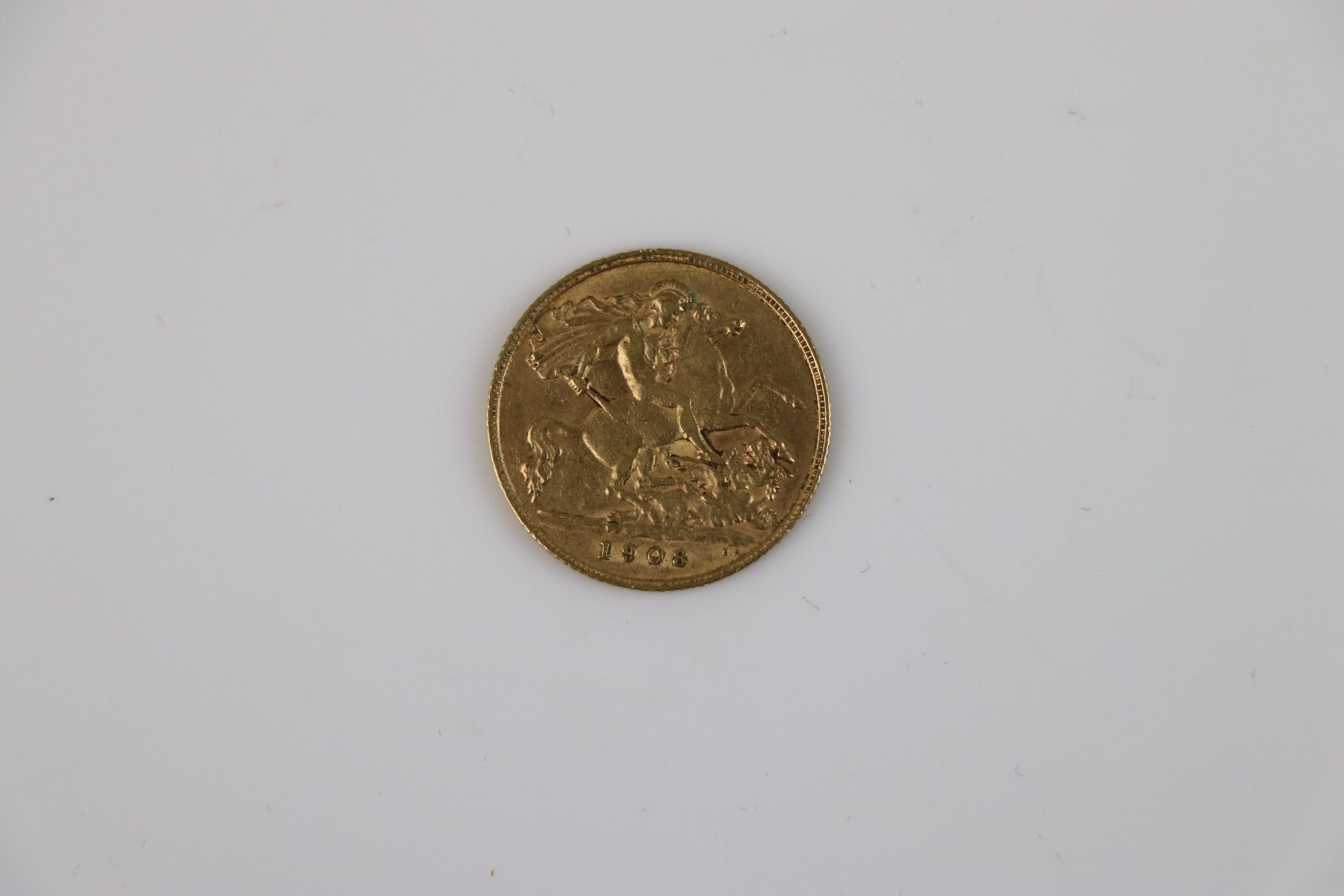 A King Edward VII Half gold Sovereign dated 1908.